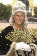 RUSSIA, St Petersburg, Portrait of a woman in historical dress wearing a wig and holding a fan