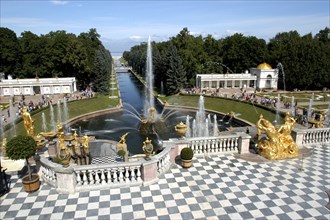 RUSSIA, Near St Petersburg, Peterhof Palace gardens. Stone balcony with chequered floor and golden