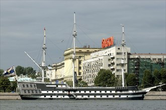 RUSSIA, St Petersburg, Ship on the river with architecture behind