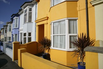 ENGLAND, East Sussex, Brighton, Brightly coloured terraced houses in Hanover area