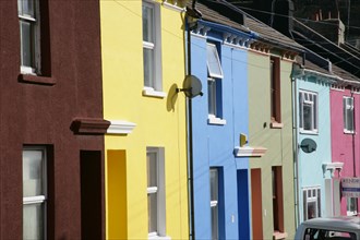 ENGLAND, East Sussex, Brighton, Brightly coloured terraced houses in Kemp Town