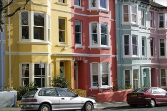 ENGLAND, East Sussex, Brighton, Brightly coloured terraced Kemp Town houses in Chesham Street