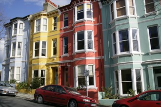 ENGLAND, East Sussex, Brighton, Brightly coloured Kemp Town terraced houses in Chesham Street