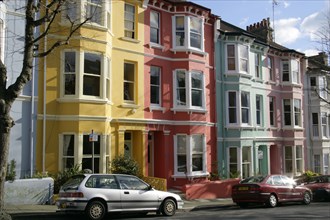 ENGLAND, East Sussex, Brighton, Brightly coloured Kemp Town terraced houses in Chesham Street