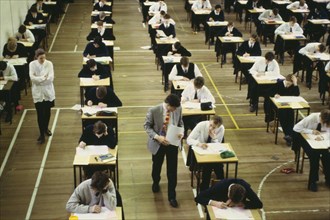 EDUCATION, Secondary, Exam, Pupils sitting O level exam watched by invigilators. GCSE