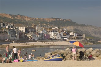 ENGLAND, Dorset, Lyme Regis, View of the town from the beach.