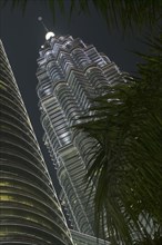 MALAYSIA, Kuala Lumpur, Angled view of the Petronas Towers illuminated at night
