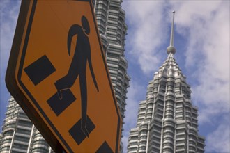 MALAYSIA, Kuala Lumpur, Pedestrian crossing sign with the Petronas Towers behind