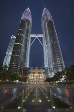 MALAYSIA, Kuala Lumpur, The Petronas Towers illuminated at night
