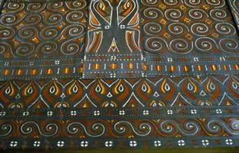 INDONESIA, Toraja, Detail of carving and painting in Toraja House.