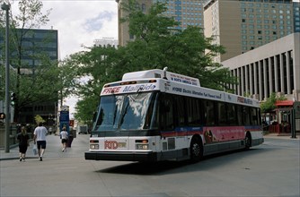 USA, Colorado, Denver, City bus turning street corner
