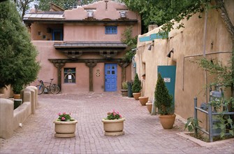 USA, Colorado, Taos Town, Street with flower tubs and traditional architecture