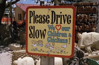 USA, New Mexico, Santa Fe, Road sign warning of children and chickens in the road