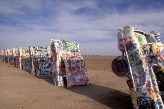 USA, Texas, Amarillo, Cadillac Ranch. Ten graffitied Cadillacs standing up ended in the soil