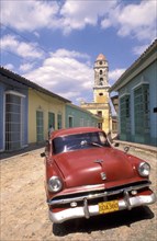 CUBA, Trinidad, Classic American car parked in the street