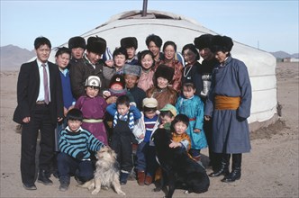 MONGOLIA, Ulaan Baatar, Three generations of one family outside their yurt.