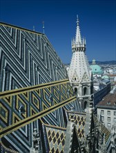 AUSTRIA, Vienna, St Stephens Cathedral aka Stephensdom with patterned roof tiles and spire seen