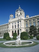 AUSTRIA, Vienna, The Natural History Museum with statue in pool in the foreground