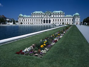 AUSTRIA, Vienna, Upper Belveder Palace southern facade seen over large pool in the gardens