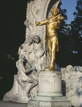 AUSTRIA, Vienna, City Park. Golden Johan Strauss statue