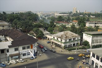 TOGO, Lome, View over road junction in the town with the docks in the distance.