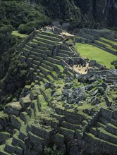 PERU, Cusco Department, Machu Picchu, View over the central plaza with main temple ruins and the