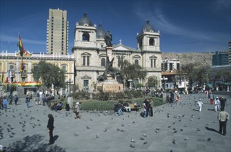 BOLIVIA, La Paz, The Cathedral seen over people gathered in the Plaza Murillo