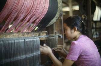 LAOS, Industry, Textiles, Young woman working in textile factory.