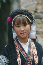 CHINA, Guizhou Province, Anshun District, Portrait of young woman of the Bouyei minority people.