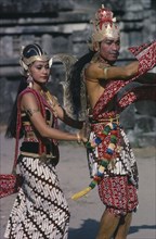INDONESIA, Java, Couple in elaborate costume performing Ramayana dance.
