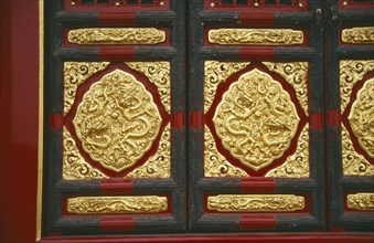 CHINA, Hebei, Beijing, "The Forbidden City.  Detail of red, black and gold decoration."