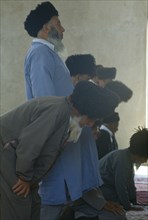 TURKMENISTAN, Ashkhabad, Turkmens at prayer in mosque.