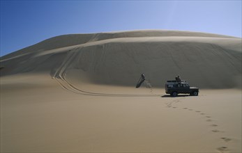 NAMIBIA, Skeleton Coast, Terrace Bay, Dune driving with jeep on the Roaring Dunes.