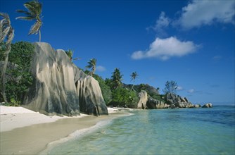 SEYCHELLES, La Digue, Anse Source d’Argent, Narrow stretch of empty sandy beach with large outcrops