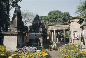 INDIA, West  Bengal, Calcutta, The British cemetery at South Park Street with laundry from resident