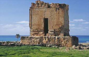 LIBYA, Tolmeita, Ruined Tomb with the sea behind
