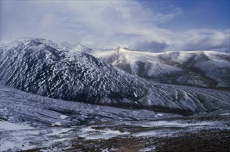 TIBET, Landscape, Mountain landscape in light covering of snow.