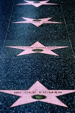 USA, California, Los Angeles, Hollywood. Pink marble and bronze stars embedded into Hollywood