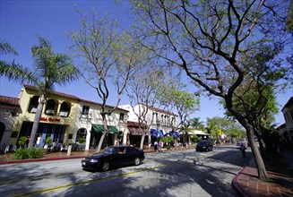 USA, California, Santa Barbara, View along State Street with shops and cafes and passing cars