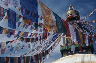 NEPAL, Kathmandu Valley, Bodhanath, Stupa hung with prayer flags for Tibetan New Year celebrations.