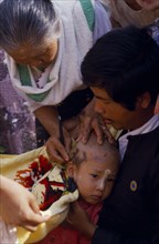 MYANMAR, Religion, Buddhist, Ritual head shaving of initiate monk.