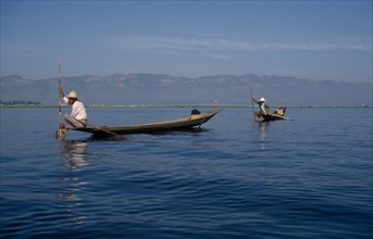 MYANMAR, Inle Lake, Fishermen with narrow wooden canoes.