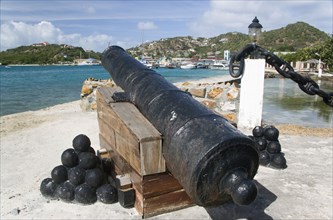 WEST INDIES, St Vincent & The Grenadines, Union Island, Ancient canon on the harbourside at Clifton