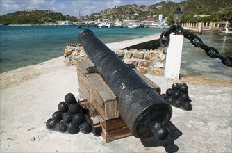 WEST INDIES, St Vincent & The Grenadines, Union Island, Ancient canon on the harbourside at Clifton