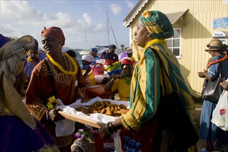 WEST INDIES, St Vincent & The Grenadines, Union Island, Women handing out food amongst the Baptist