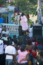 WEST INDIES, St Vincent & The Grenadines, Union Island, Singer and guitarist with sound system at