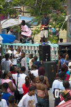 WEST INDIES, St Vincent & The Grenadines, Union Island, Singer and guitarist by sound system at