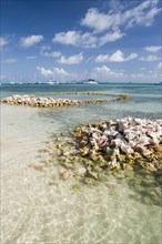 WEST INDIES, St Vincent & The Grenadines, Union Island, Conch shell structures on the beach at
