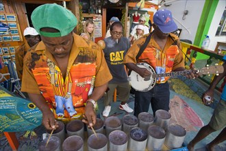 WEST INDIES, St Vincent & The Grenadines, Union Island, Miniature steel drum pan player and band