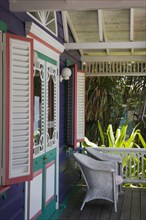 WEST INDIES, St Vincent & The Grenadines, Mustique, Chattel house shop veranda in Britannia Bay